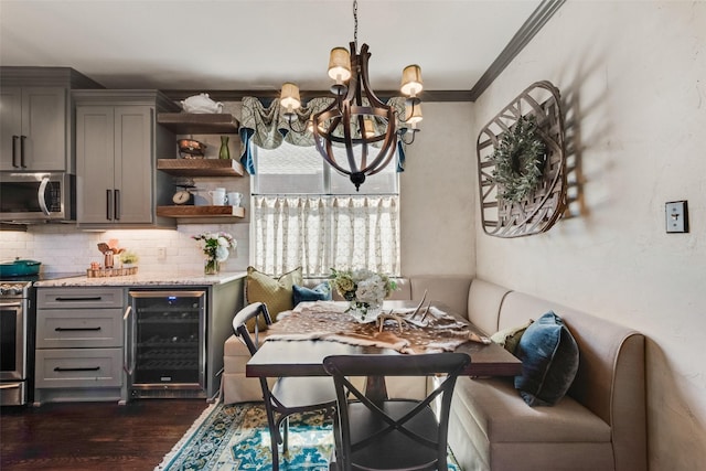 2466 Campfire Ln, Frisco, TX 75033 - dining space with wine cooler, a chandelier, dark wood-type flooring, and crown molding