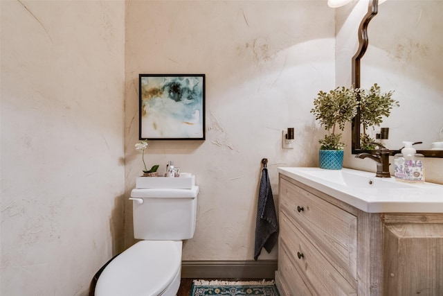 2466 Campfire Ln, Frisco, TX 75033 - half bath with toilet, vanity, and baseboards