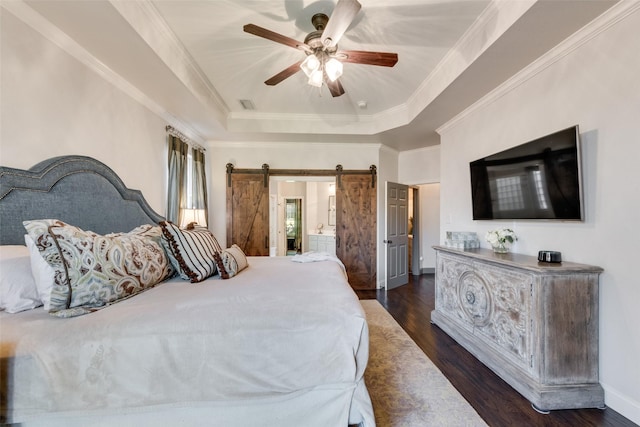 2466 Campfire Ln, Frisco, TX 75033 - bedroom with dark wood-type flooring, a tray ceiling, crown molding, a barn door, and a ceiling fan