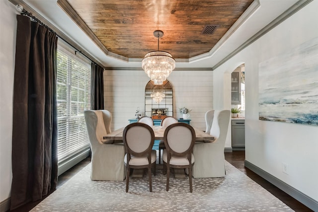 2466 Campfire Ln, Frisco, TX 75033 - dining room featuring wooden ceiling, a raised ceiling, a chandelier, arched walkways, and crown molding