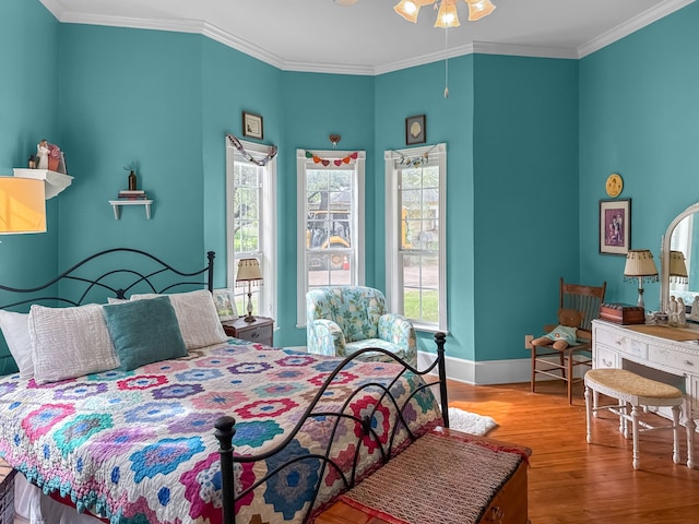 303 E Mclain, Iredell, TX 76649 - bedroom featuring wood finished floors, baseboards, and ornamental molding