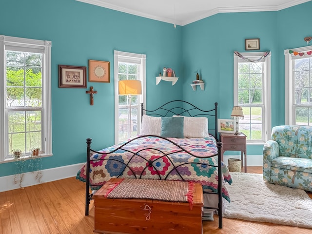303 E Mclain, Iredell, TX 76649 - bedroom featuring crown molding, baseboards, and wood finished floors