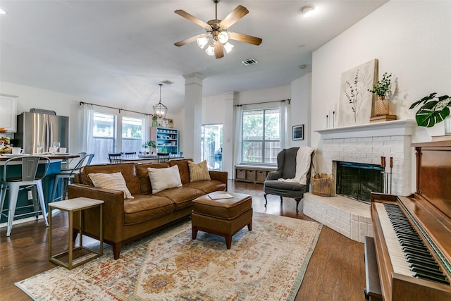 3952 Eaglerun Dr, Fort Worth, TX 76262 - living area with ceiling fan, dark wood-style floors, and a fireplace