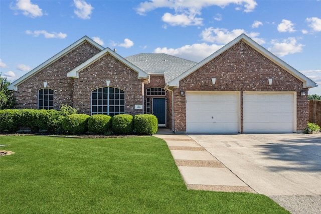 108 Rolling Rock Dr, Trophy Club, TX 76262 - traditional home featuring concrete driveway, brick siding, a front lawn, an attached garage, and a shingled roof