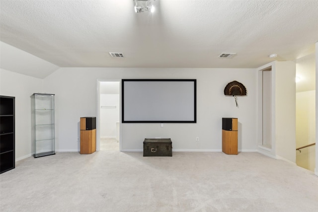 108 Rolling Rock Dr, Trophy Club, TX 76262 - cinema featuring a textured ceiling, carpet flooring, baseboards, and lofted ceiling