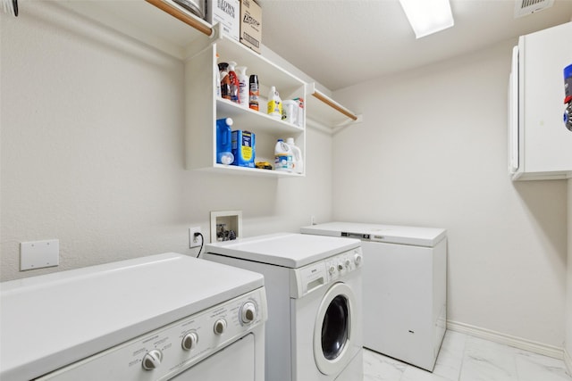 108 Rolling Rock Dr, Trophy Club, TX 76262 - laundry area featuring washer and dryer, light marble finish flooring, and baseboards