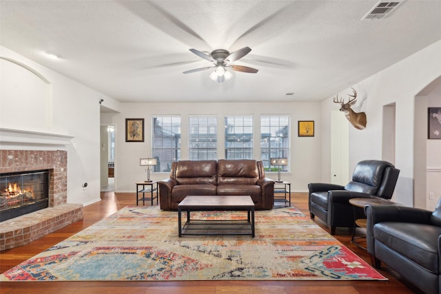 108 Rolling Rock Dr, Trophy Club, TX 76262 - living area featuring ceiling fan, wood finished floors, and a brick fireplace