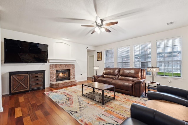 108 Rolling Rock Dr, Trophy Club, TX 76262 - living area featuring a ceiling fan, wood finished floors, a brick fireplace, and baseboards