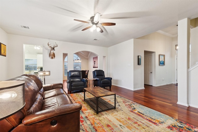 108 Rolling Rock Dr, Trophy Club, TX 76262 - living room featuring a ceiling fan, arched walkways, wood finished floors, and baseboards