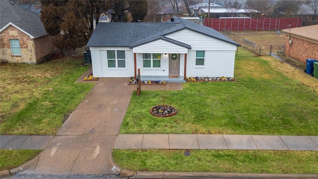 1213 Bowie St, Garland, TX 75040 - view of front of home with brick siding and roof with shingles