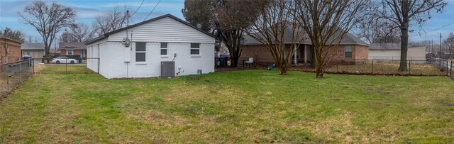 1213 Bowie St, Garland, TX 75040 - back of house with brick siding and central AC
