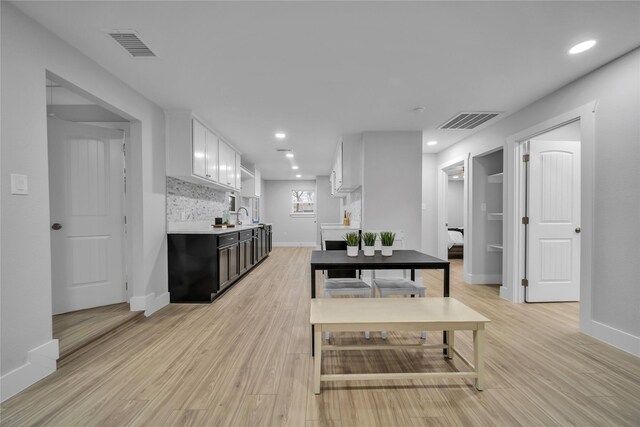 1213 Bowie St, Garland, TX 75040 - dining space with light wood finished floors, baseboards, and recessed lighting