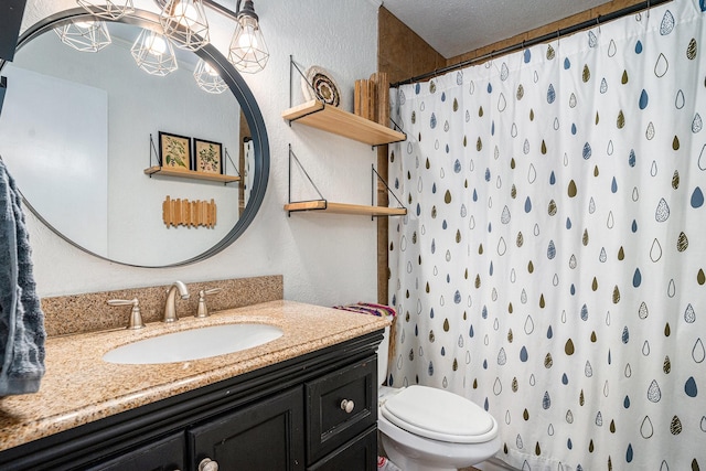 704 Vaughn Dr, Burleson, TX 76028 - bathroom featuring a textured wall, vanity, toilet, a shower with curtain, and a chandelier