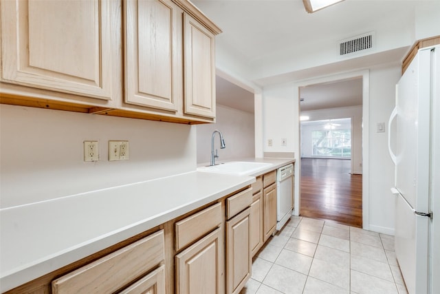 8639 Edgemere Rd Unit 1A, Dallas, TX 75225 - kitchen featuring white appliances, a sink, light brown cabinets, and light countertops