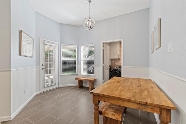 6436 Branchwood Trl, The Colony, TX 75056 - dining room with washer / dryer, a chandelier, and wainscoting