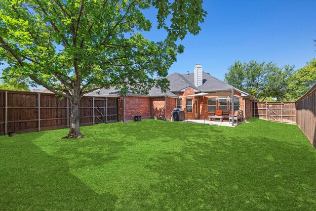 6436 Branchwood Trl, The Colony, TX 75056 - back of property featuring a patio, brick siding, and a chimney