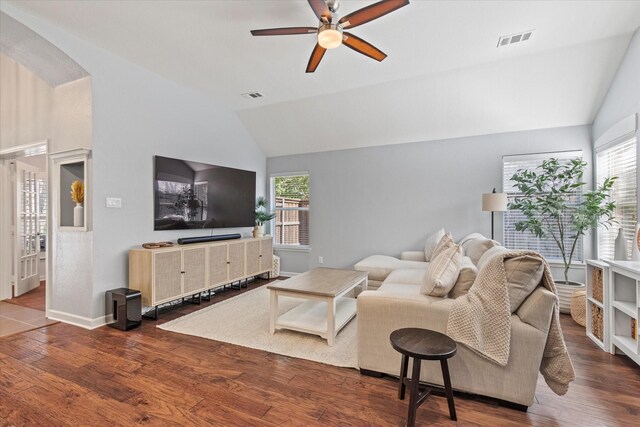 6436 Branchwood Trl, The Colony, TX 75056 - living area with lofted ceiling, ceiling fan, plenty of natural light, wood finished floors, and arched walkways