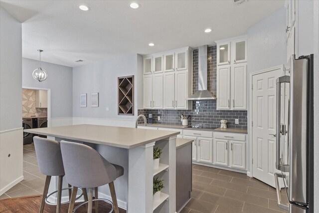 6436 Branchwood Trl, The Colony, TX 75056 - kitchen featuring freestanding refrigerator, wall chimney exhaust hood, open shelves, white cabinetry, and light countertops