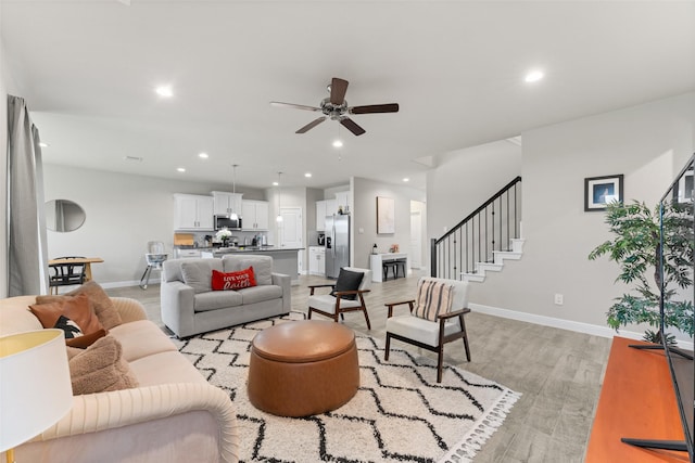 1225 Rolling Meadows Dr, Cedar Hill, TX 75104 - living room with light wood finished floors, ceiling fan, baseboards, recessed lighting, and stairs