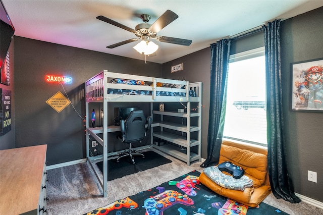 211 Hilltop Cir, Blue Ridge, TX 75424 - carpeted bedroom featuring an office area, a textured wall, baseboards, and a ceiling fan