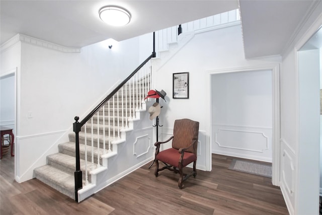 19413 US Highway 79 E, Jacksonville, TX 75766 - stairway featuring wood finished floors, a decorative wall, and wainscoting