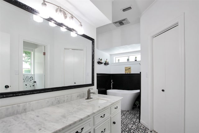 19413 US Highway 79 E, Jacksonville, TX 75766 - full bath with vanity, plenty of natural light, and a soaking tub