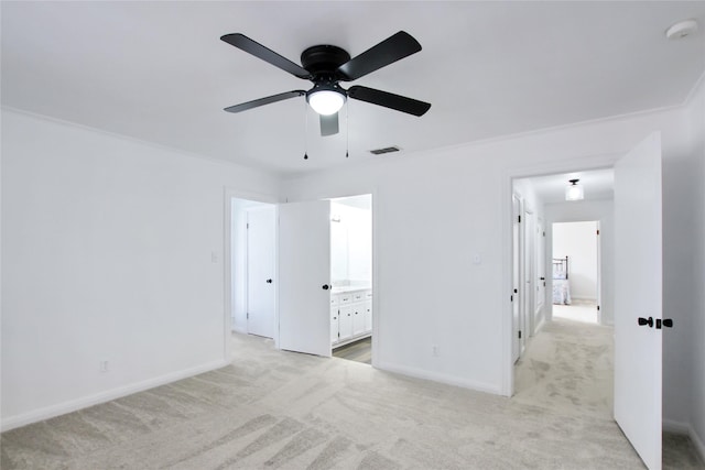 19413 US Highway 79 E, Jacksonville, TX 75766 - unfurnished bedroom with light colored carpet, baseboards, connected bathroom, and ceiling fan
