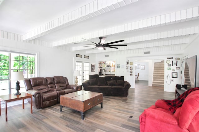 19413 US Highway 79 E, Jacksonville, TX 75766 - living area featuring stairs, wood finished floors, beam ceiling, ceiling fan, and french doors