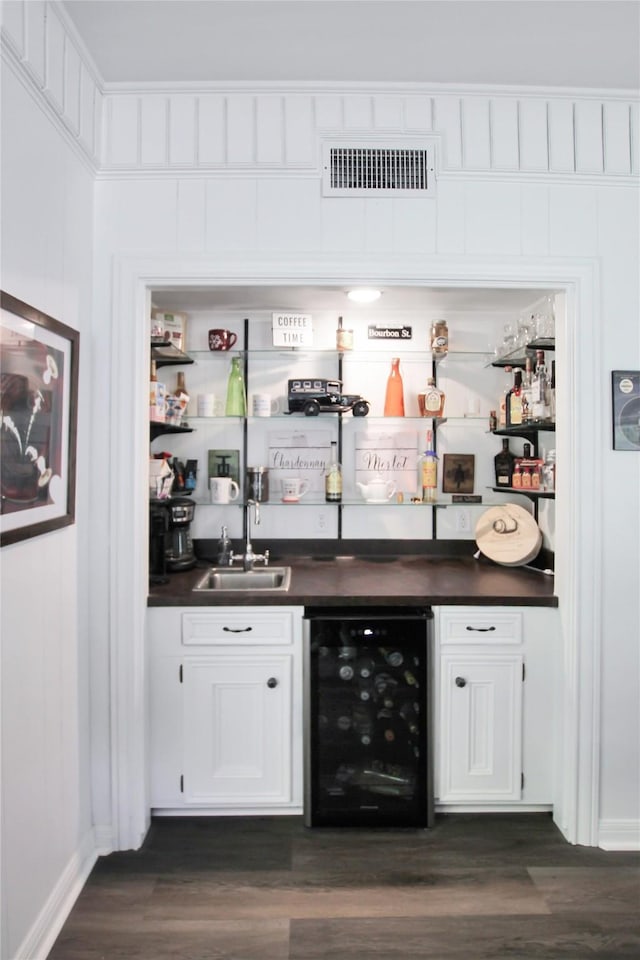 19413 US Highway 79 E, Jacksonville, TX 75766 - indoor wet bar with wine cooler, dark wood-style floors, and baseboards