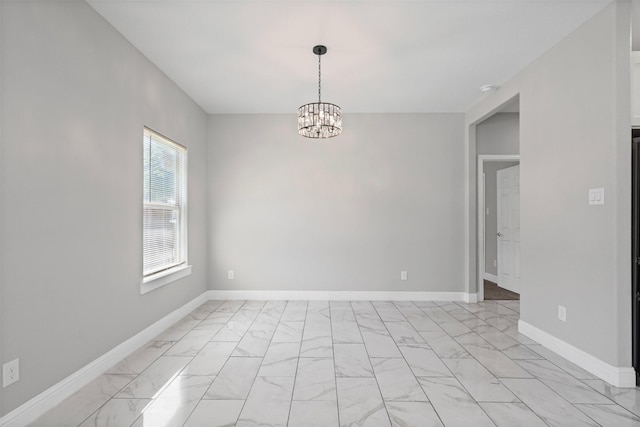 2636 Carter Ave, Fort Worth, TX 76103 - unfurnished room featuring light marble finish flooring, a chandelier, and baseboards
