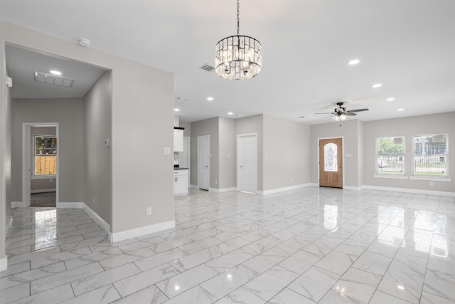 2636 Carter Ave, Fort Worth, TX 76103 - unfurnished living room featuring recessed lighting, light marble finish floors, baseboards, a chandelier, and ceiling fan