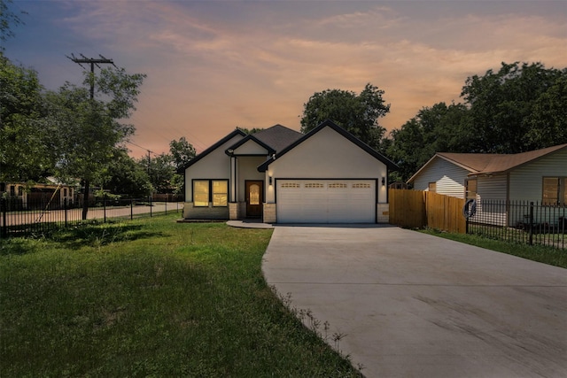 2636 Carter Ave, Fort Worth, TX 76103 - view of front of property featuring driveway, stucco siding, and a garage