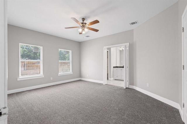 2636 Carter Ave, Fort Worth, TX 76103 - unfurnished room with carpet floors, a ceiling fan, and baseboards