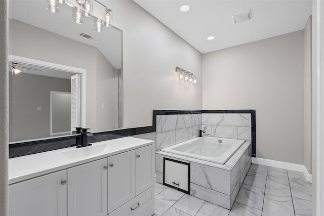 2636 Carter Ave, Fort Worth, TX 76103 - full bathroom with marble finish floors, vanity, a bath, baseboards, and recessed lighting