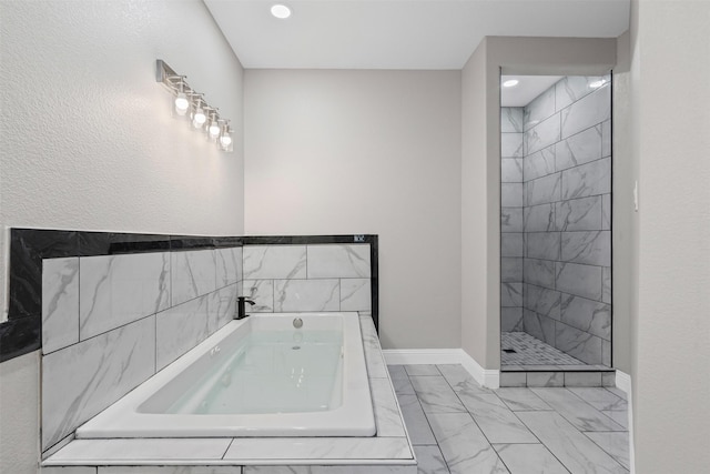 2636 Carter Ave, Fort Worth, TX 76103 - full bathroom with marble look tiles, a bath, baseboards, tiled shower, and recessed lighting