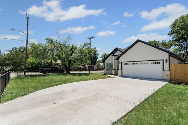 2636 Carter Ave, Fort Worth, TX 76103 - view of front facade featuring driveway, a garage, stucco siding, and stone siding