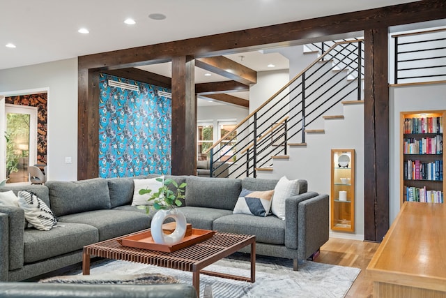 living area featuring recessed lighting, stairs, and light wood-style floors