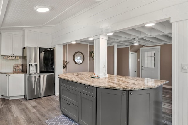 7928 Farm Rd Unit 127, Mount Pleasant, TX 75455 - kitchen with stainless steel fridge with ice dispenser, gray cabinetry, light wood-style flooring, white cabinetry, and ornamental molding