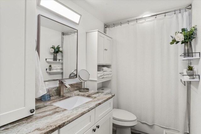 7928 Farm Rd Unit 127, Mount Pleasant, TX 75455 - bathroom with toilet and vanity