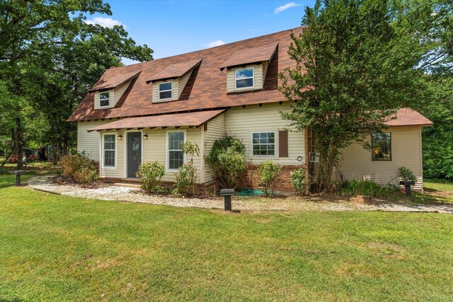 7928 Farm Rd Unit 127, Mount Pleasant, TX 75455 - colonial inspired home with a front yard