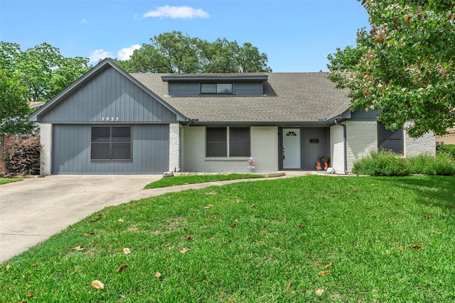 2935 Maydelle Ln, Farmers Branch, TX 75234 - view of front facade featuring a shingled roof, a front yard, brick siding, and concrete driveway