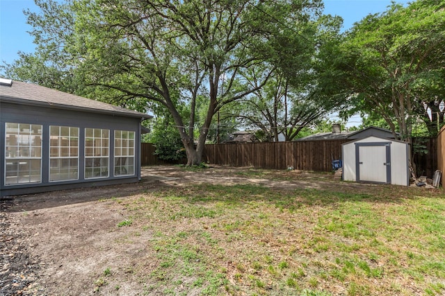 2935 Maydelle Ln, Farmers Branch, TX 75234 - view of yard featuring a storage shed and an outbuilding