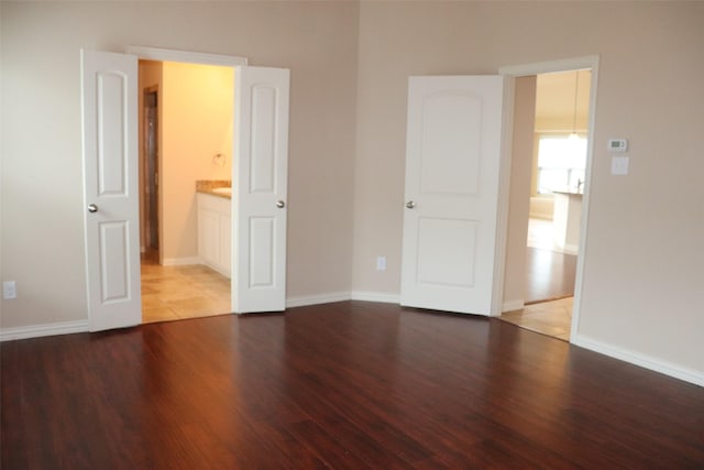 414 Stonecreek Dr, Princeton, TX 75407 - unfurnished bedroom with wood finished floors and baseboards