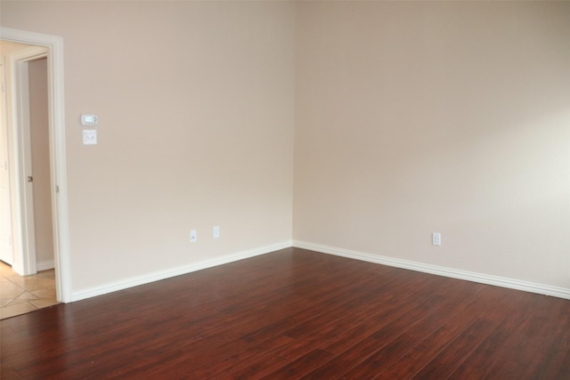 414 Stonecreek Dr, Princeton, TX 75407 - spare room with dark wood-style floors and baseboards