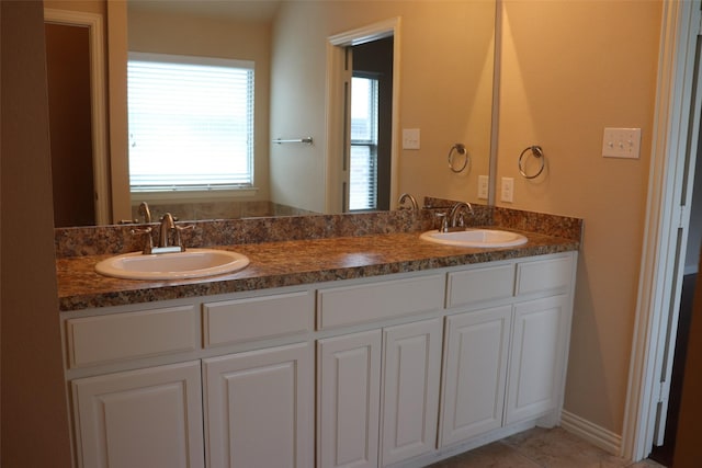 414 Stonecreek Dr, Princeton, TX 75407 - full bathroom with double vanity and tile patterned floors