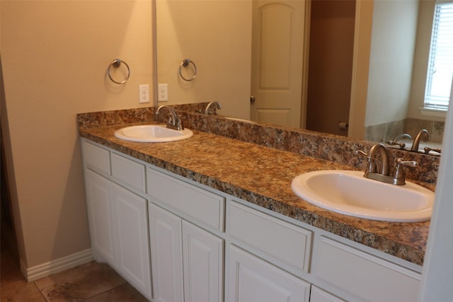 414 Stonecreek Dr, Princeton, TX 75407 - full bath featuring tile patterned flooring, double vanity, and baseboards