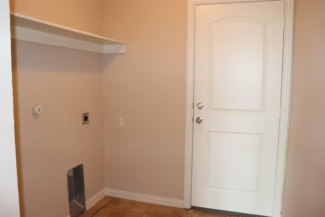 414 Stonecreek Dr, Princeton, TX 75407 - clothes washing area with electric dryer hookup, baseboards, and light tile patterned floors