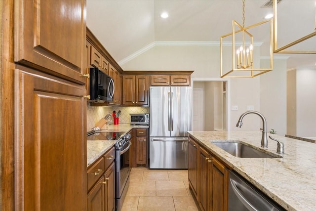 213 Desert Sky Dr, Mcgregor, TX 76657 - kitchen with appliances with stainless steel finishes, a sink, vaulted ceiling, decorative backsplash, and light stone countertops