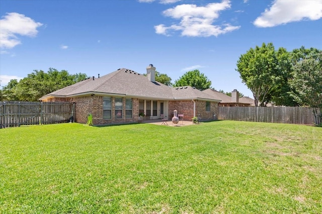 213 Desert Sky Dr, Mcgregor, TX 76657 - rear view of property featuring a patio area, brick siding, a chimney, and a shingled roof
