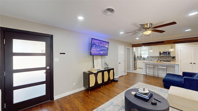 1408 Briarwood Blvd, Arlington, TX 76013 - living area featuring baseboards, dark wood-type flooring, a ceiling fan, and recessed lighting